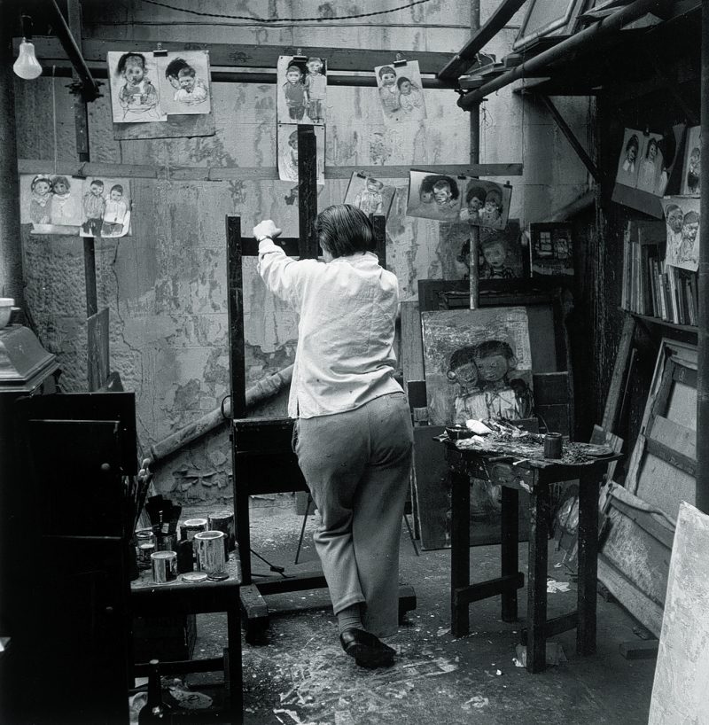Eardley in her studio at 204 St James Road, Townhead in Glasgow with chalk sketches of children c. 1950s